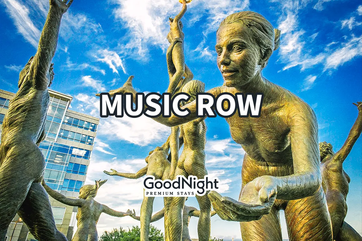 An exterior scene featuring artistic sculptures of figures with a text overlay reading 'MUSIC ROW' and 'GoodNight PREMIUM STAYS.' The mood is celebratory and artistic, highlighting Nashville’s rich local culture and music heritage.